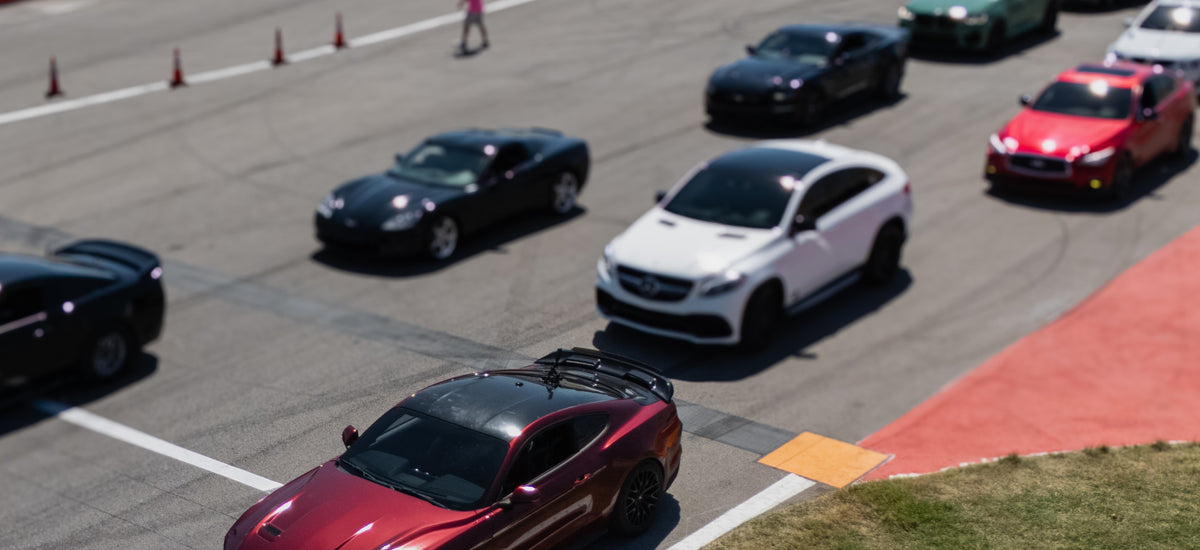 DBR High Performance on the track at Slush Motorsports Festival, aerial drone photo.